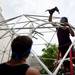 Comcast Xfinity on-site specialists Tim Randolph  and Ryan Henning help construct a structure for the Ann Arbor Art Fair on Tuesday, July 16. Daniel Brenner I AnnArbor.com